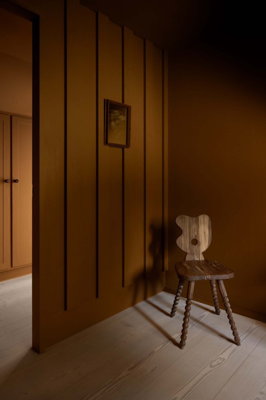 Warm timber wall with chair