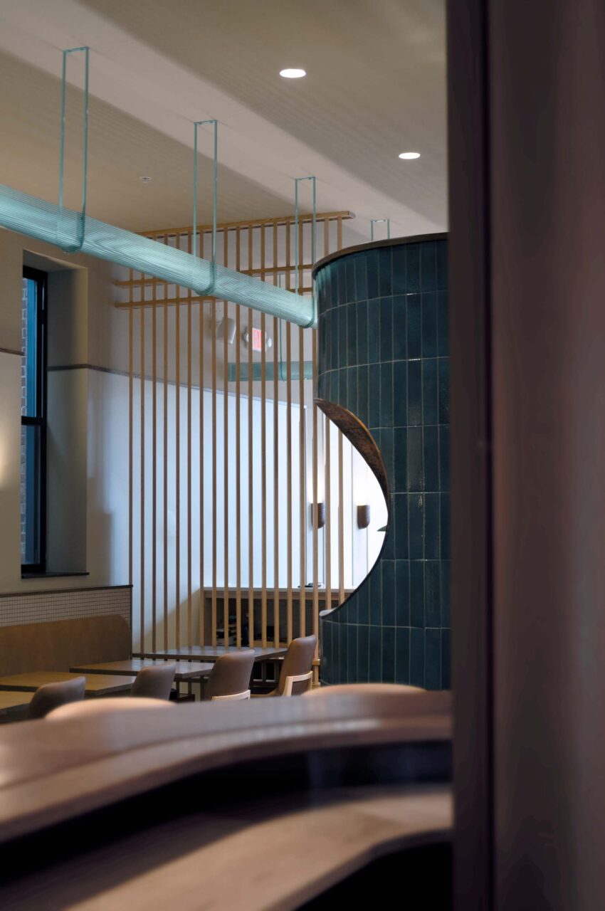 lighting trough winds through restaurant