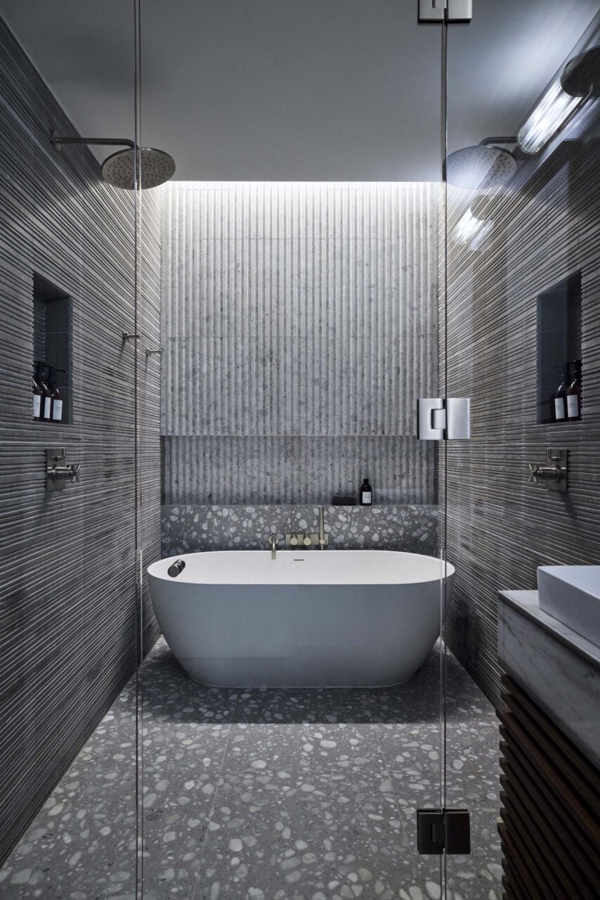 bathroom covered in gray tiles