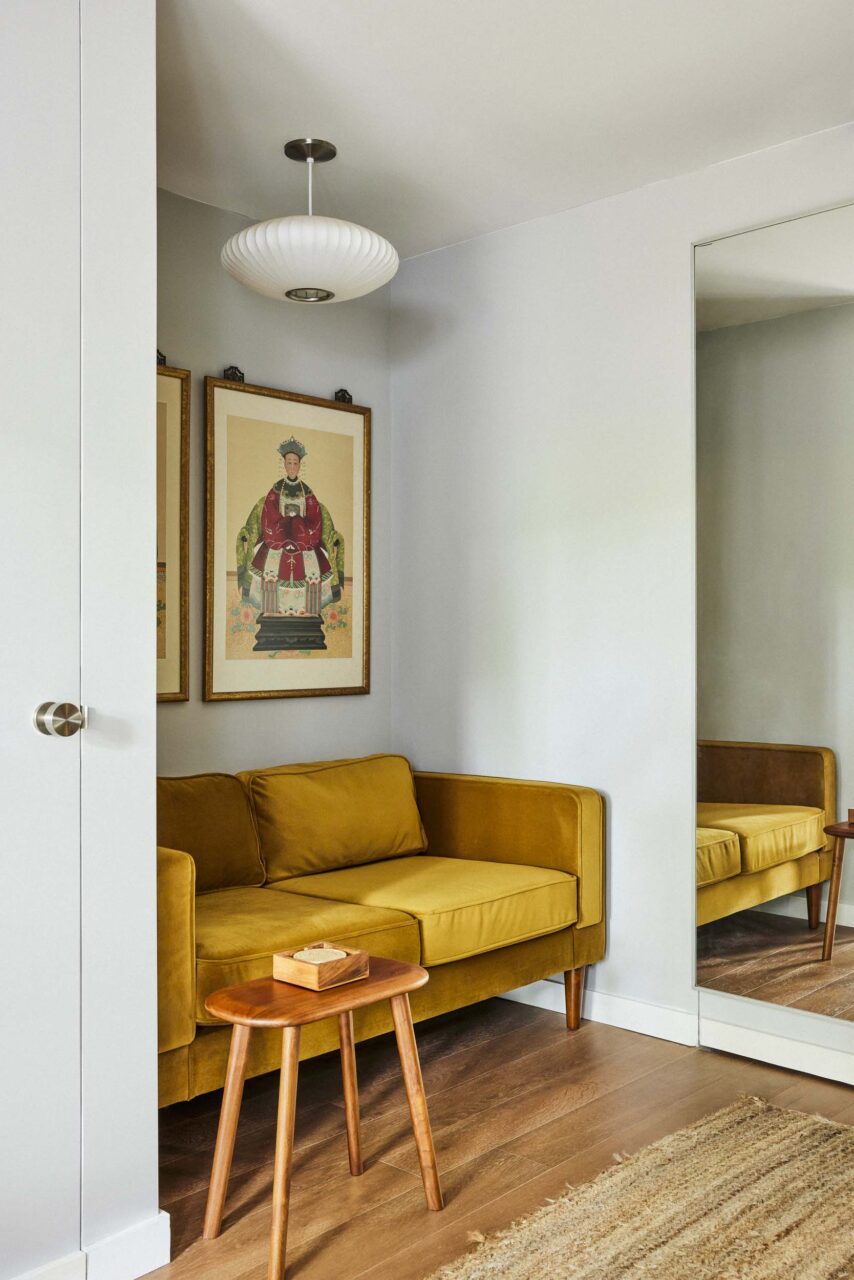 A small couch in a hallway
