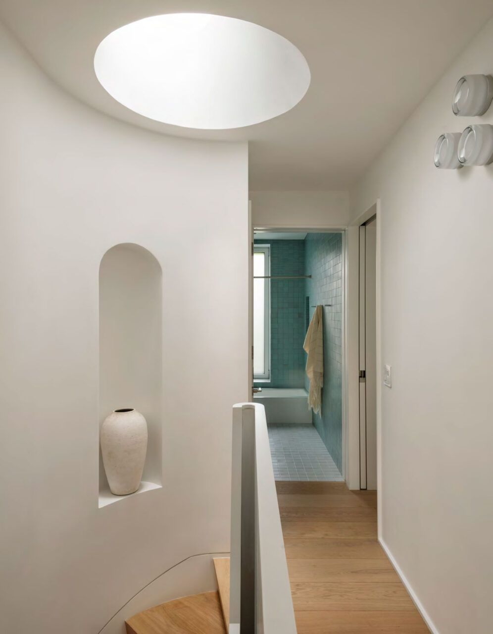 The top of the stairs is lit with a skylight