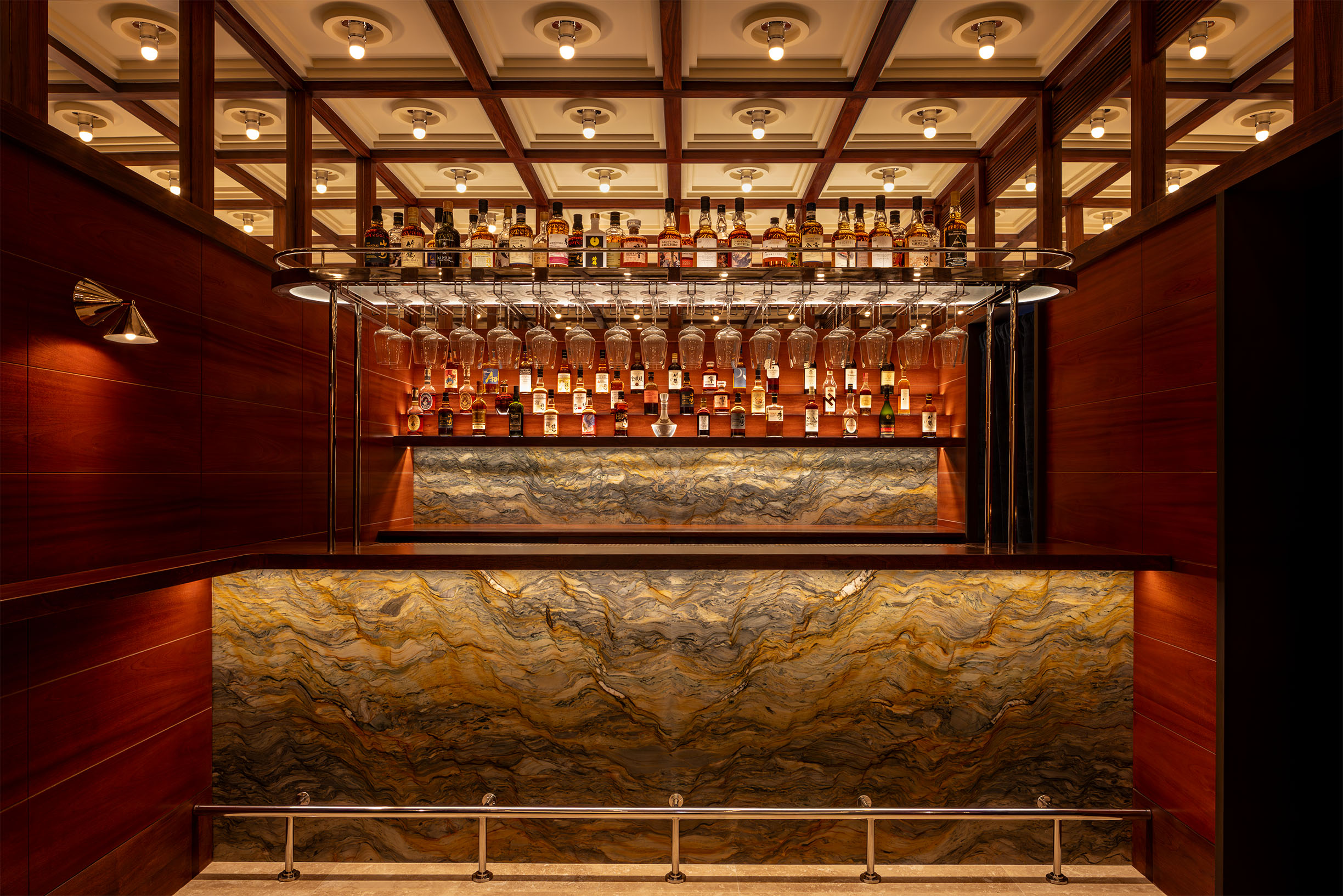 bar at french restaurant with coffered ceilings