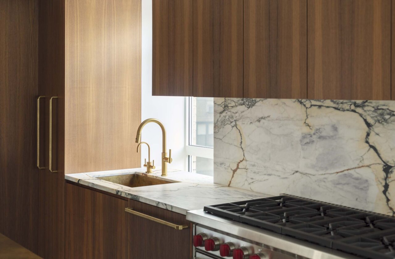 walnut cabinetry and metal hardware in kitchen