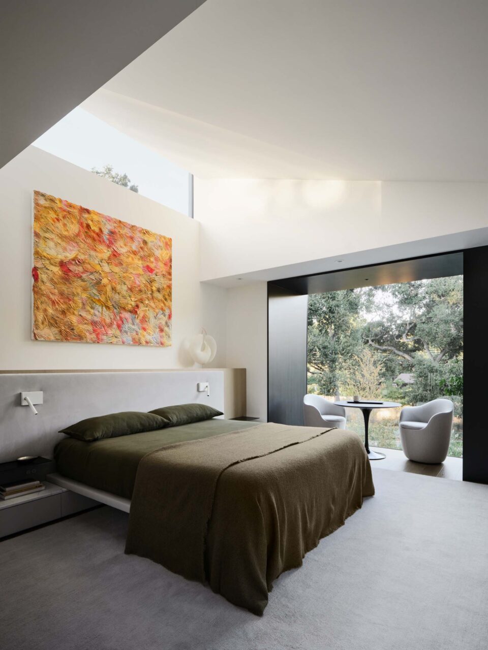 bedroom with black metal-framed seating nook