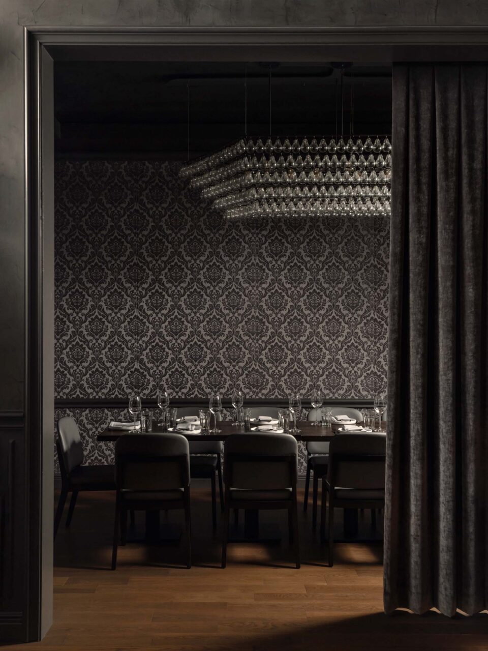 wine room with black wallpaper
