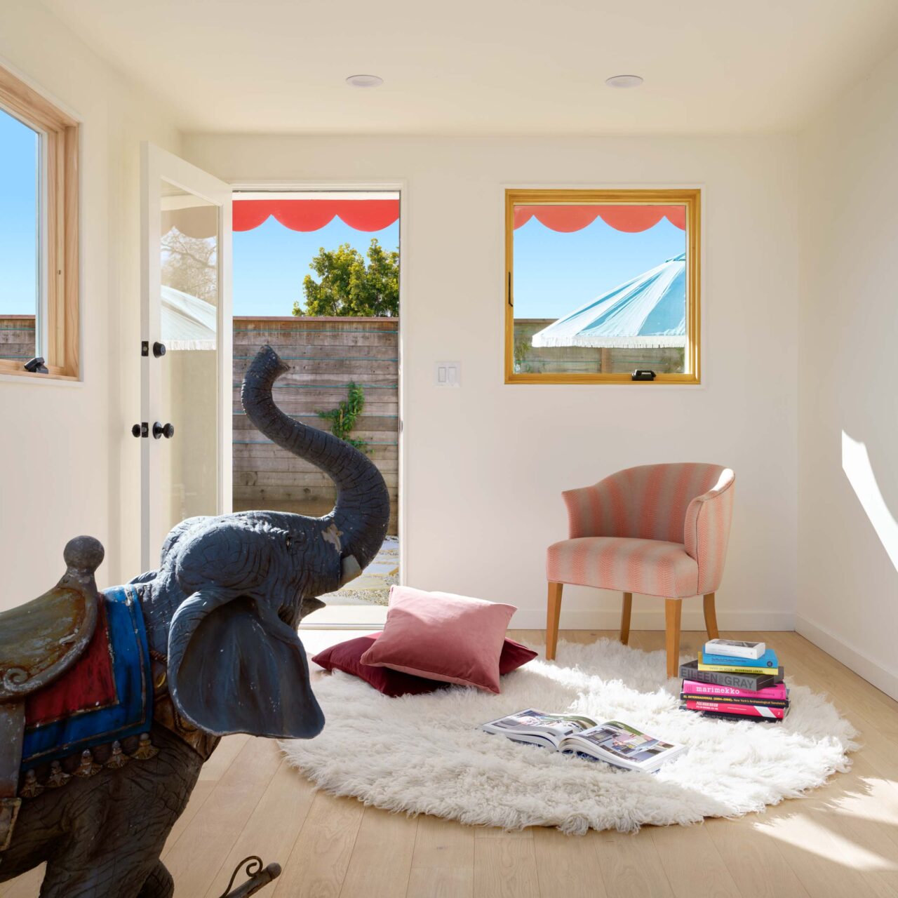 elephant toy and chair sit in living room