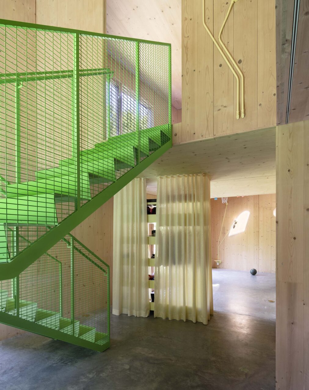 green steel stairs in wood house