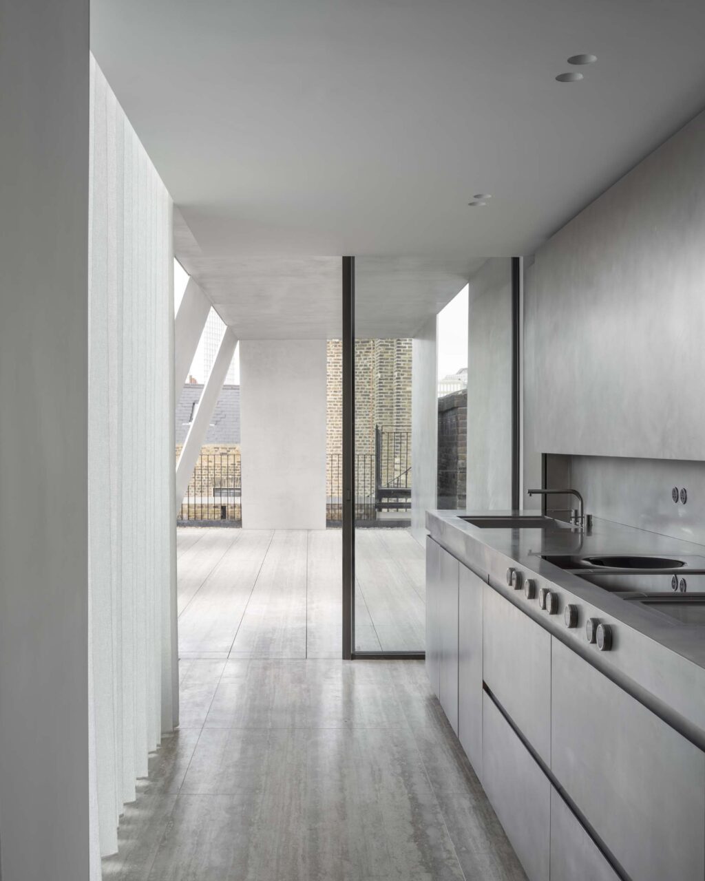 stainless steel kitchen on top floor by carmody