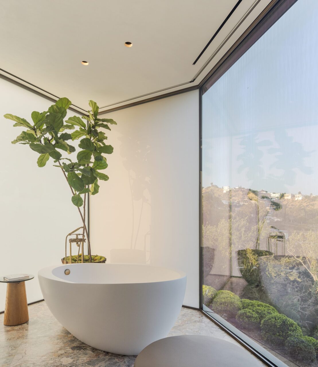 bathtub in front of angular windows
