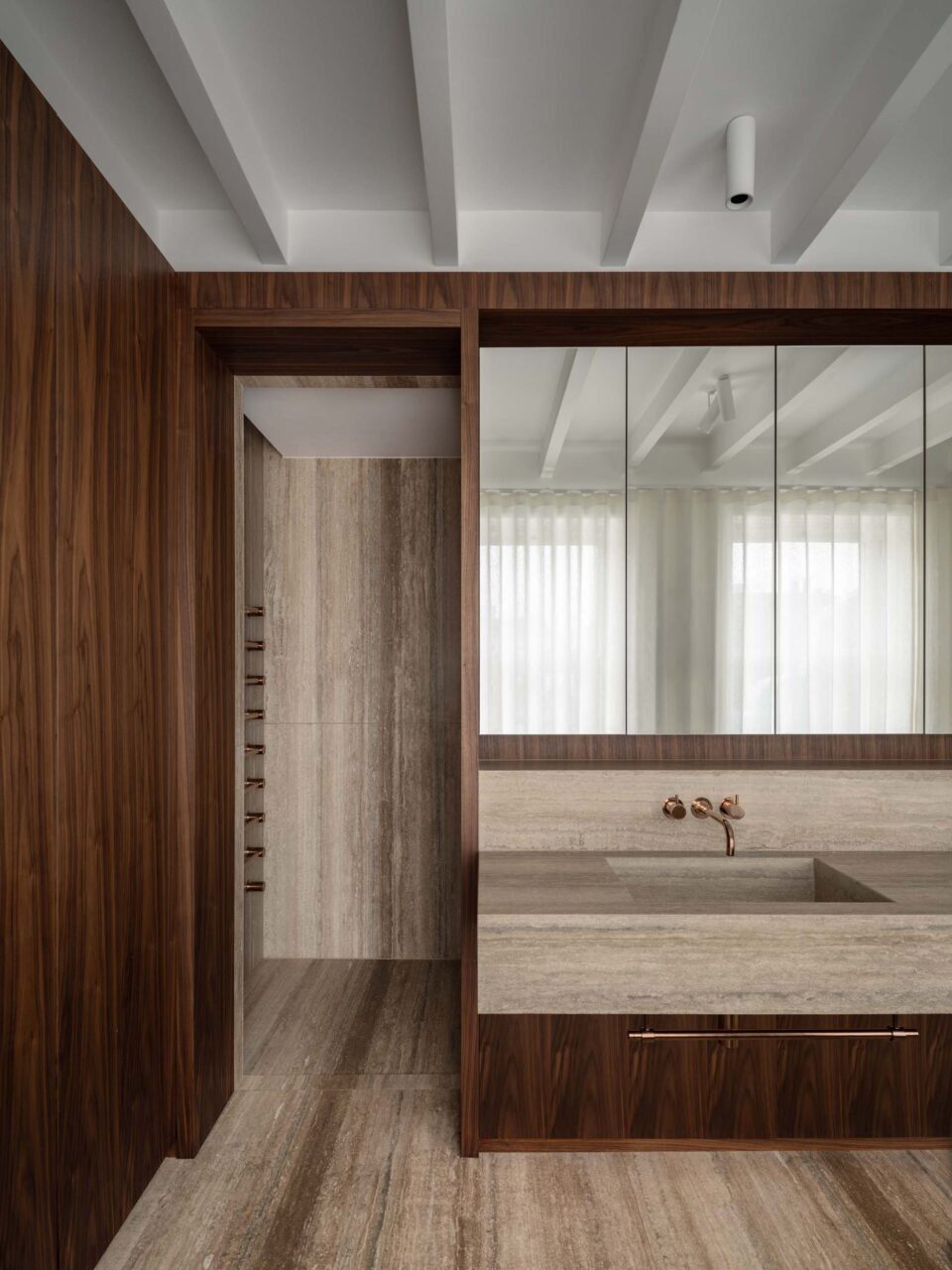 bathroom with wood and travertine
