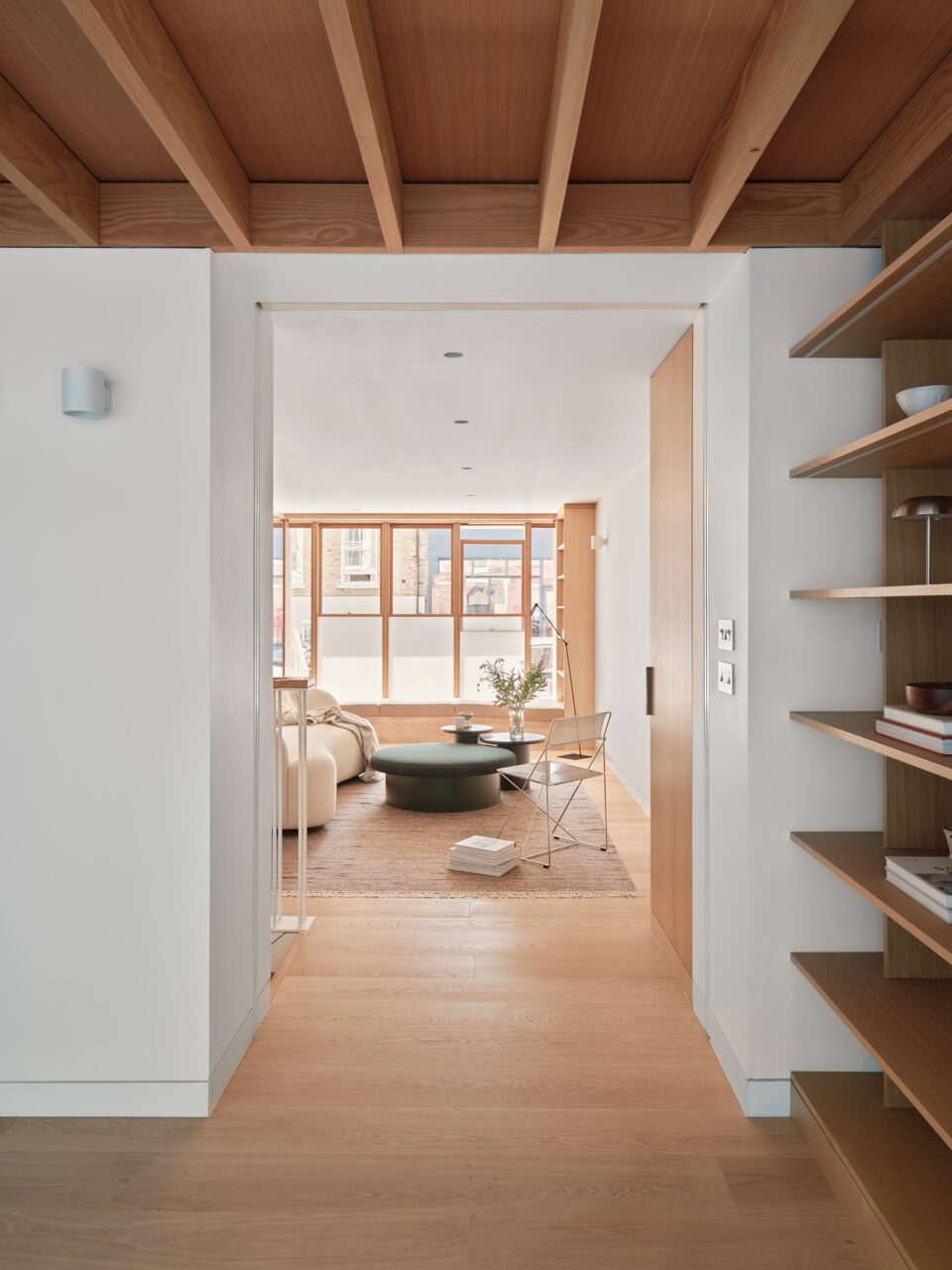 white oak windows in living room as seen through the study
