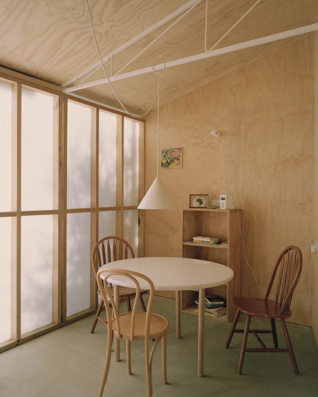 small dining room set in wood-clad room