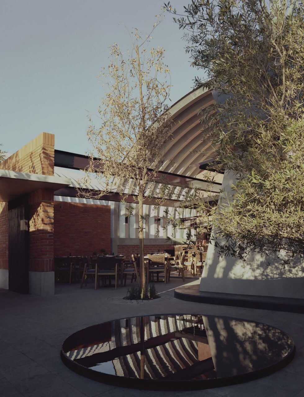 outdoor restaurant with circular pond