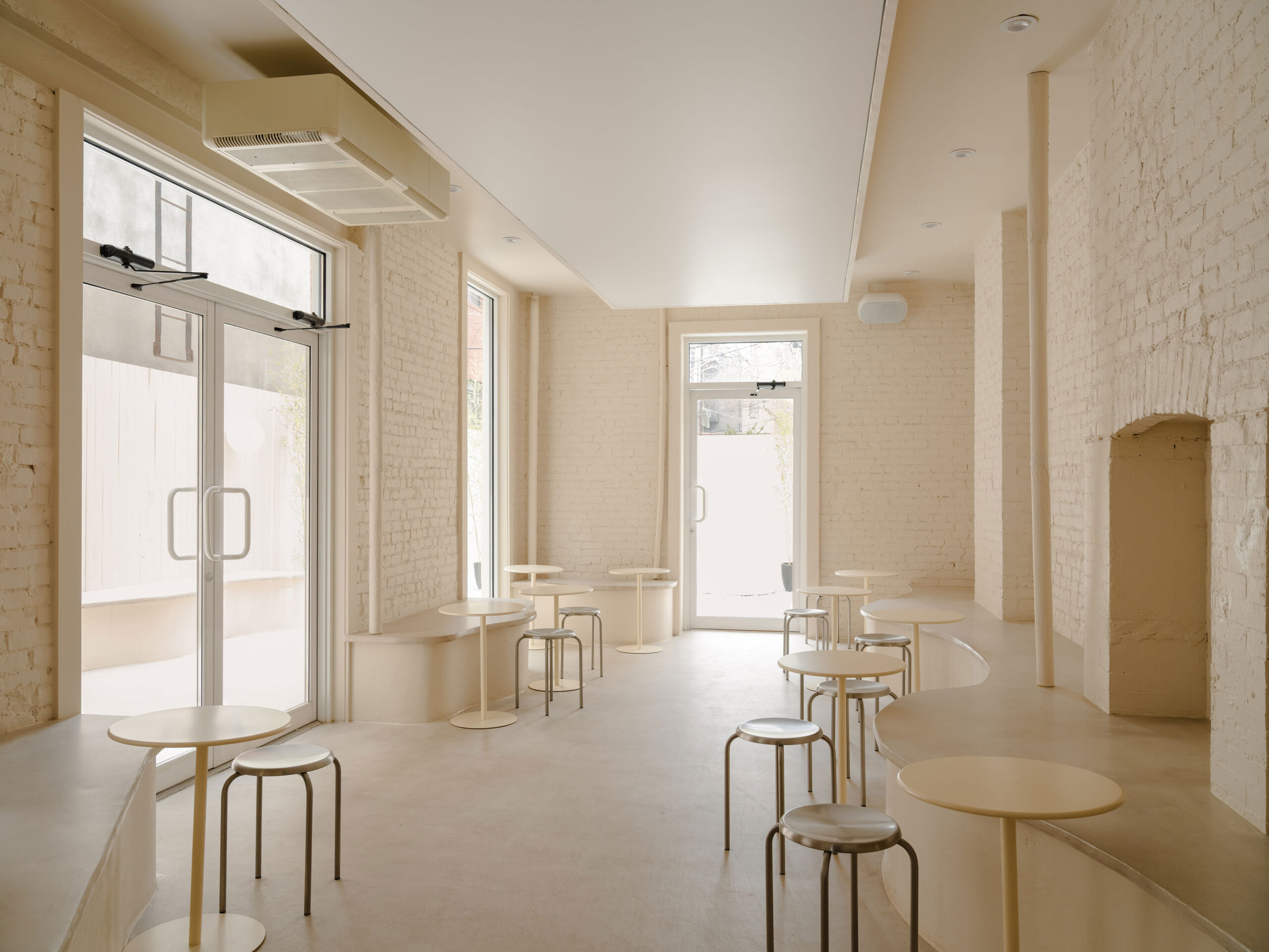 banquettes in all white coffee shop