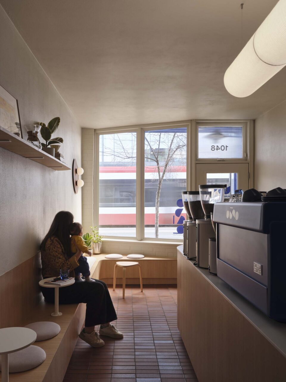 brick flooring and new service counter by architecture riot