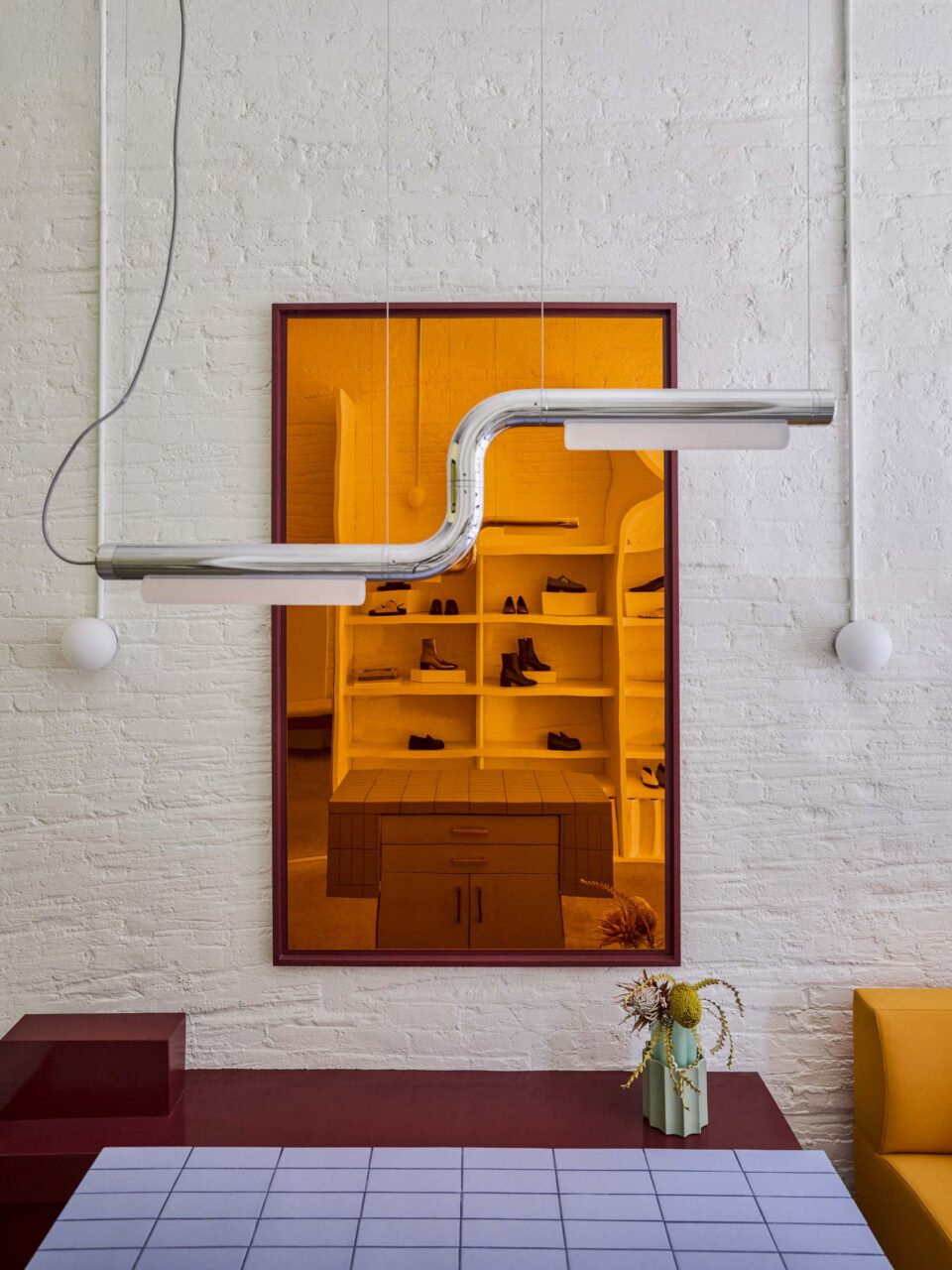 steel lighting over orange mirror