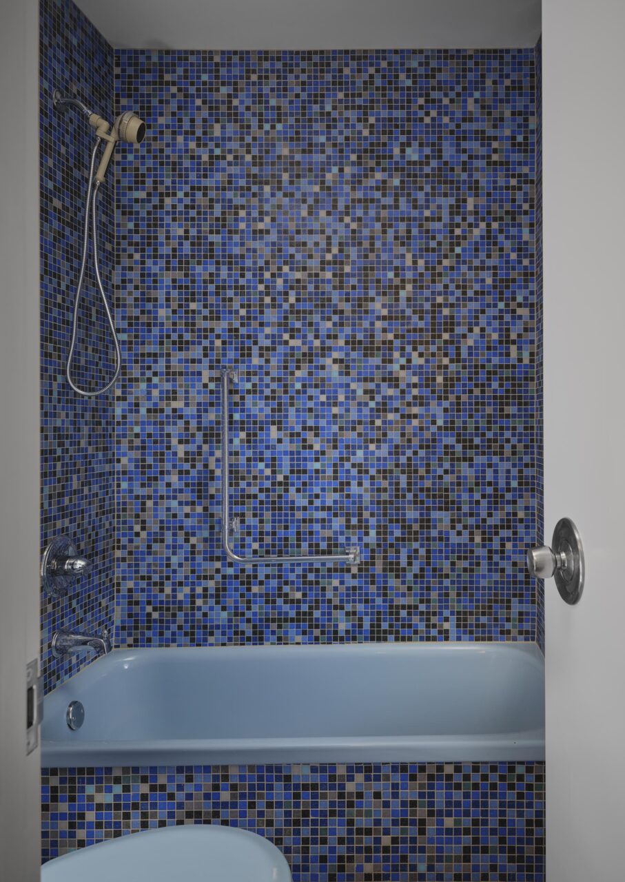 MAS studio and future firm renovate apartment bathroom with glass tile