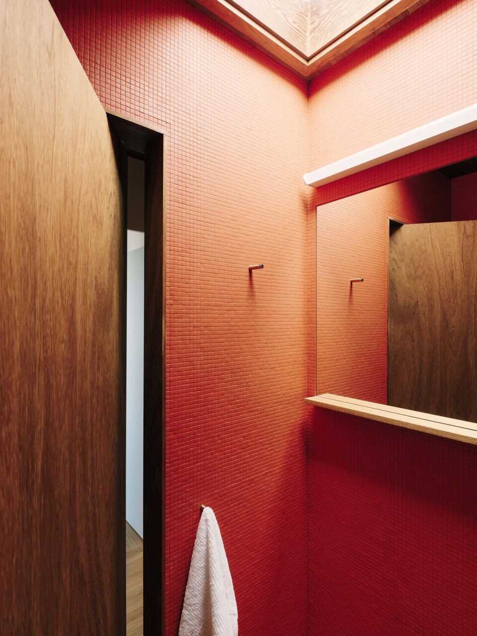 skylight in red-tiled bathroom