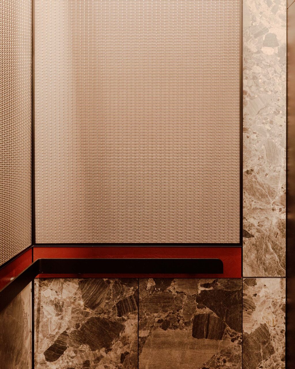 elevator with metal screen and marble