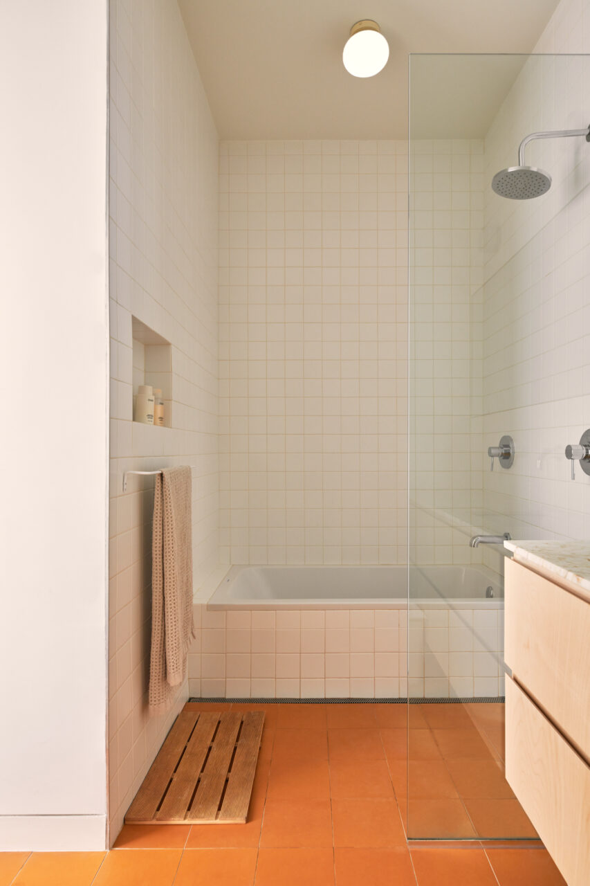 bathroom with orange floor tiles