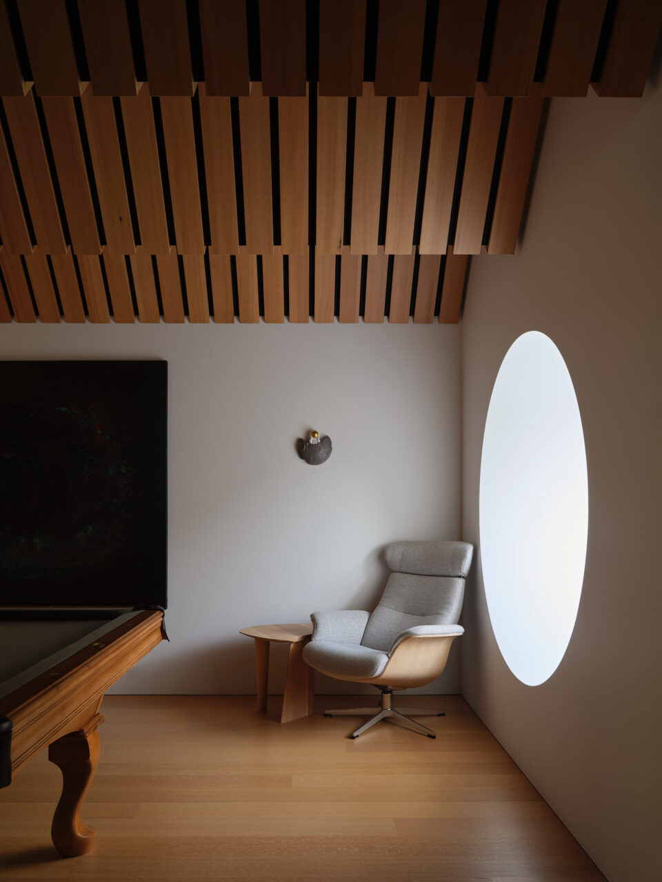 lounge chair by circular window