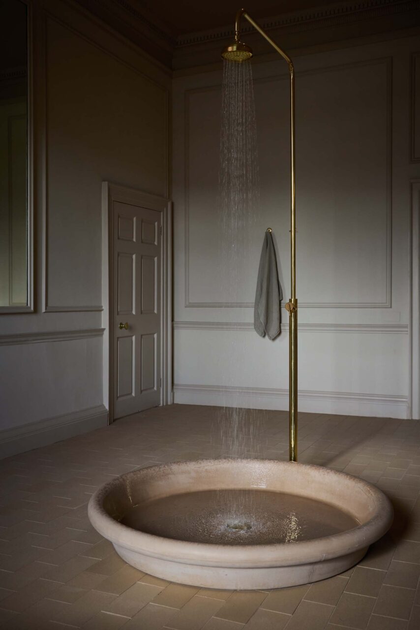 shower with no curtains or partitions