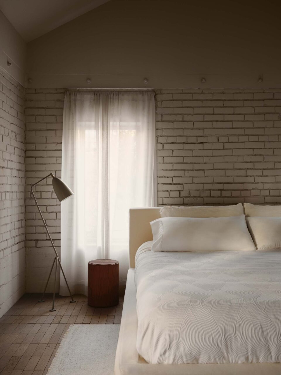 bedroom with white brick
