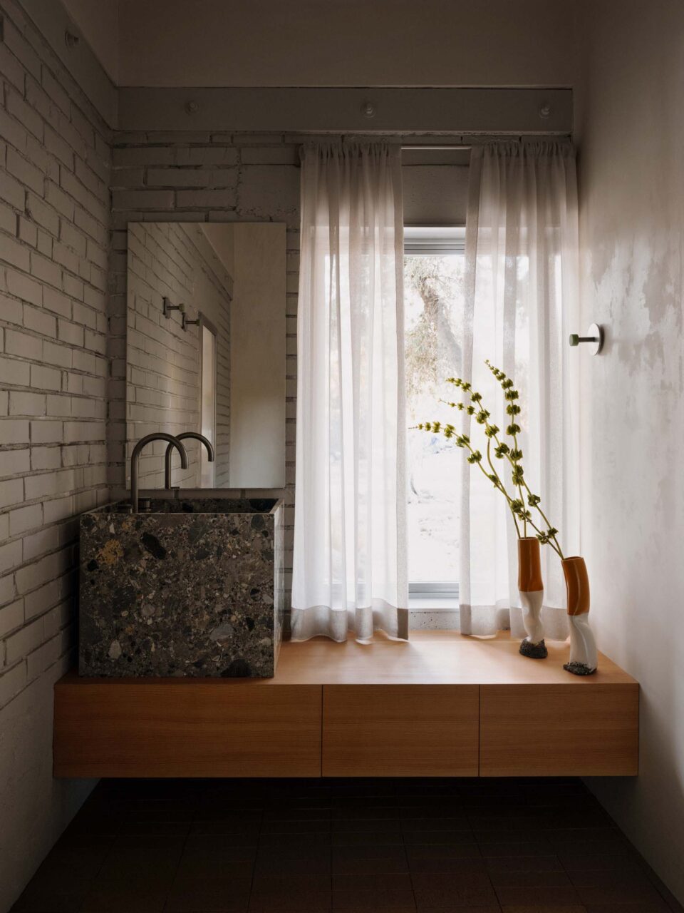 bathroom with stone sink