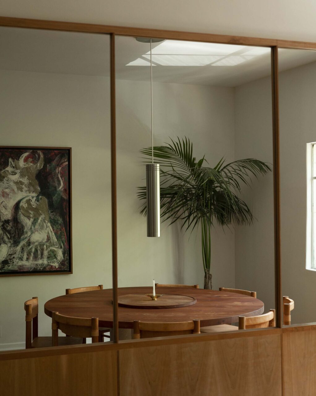 dining room with wall of mirrors